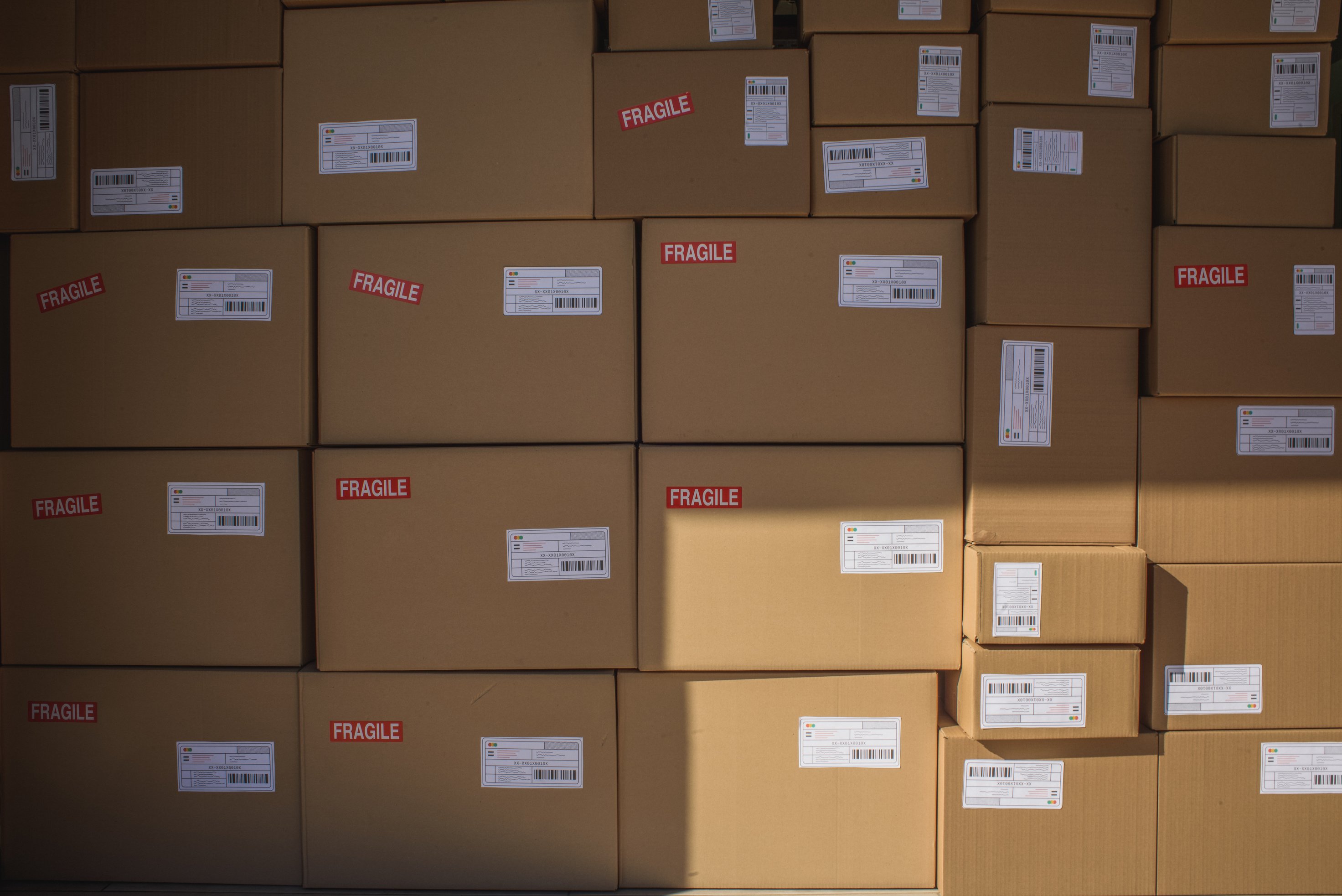 Courier Service Stacks of Delivery Boxes